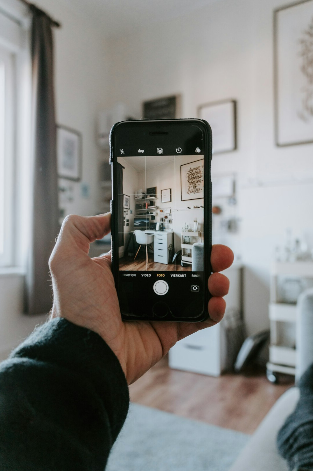 person using smartphone at home