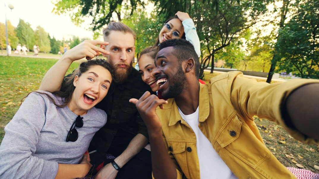diverse friends talking outdoors
