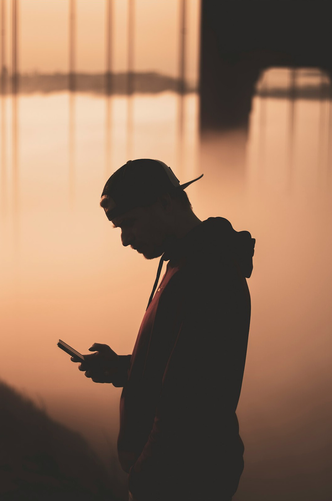 person thinking alone with phone