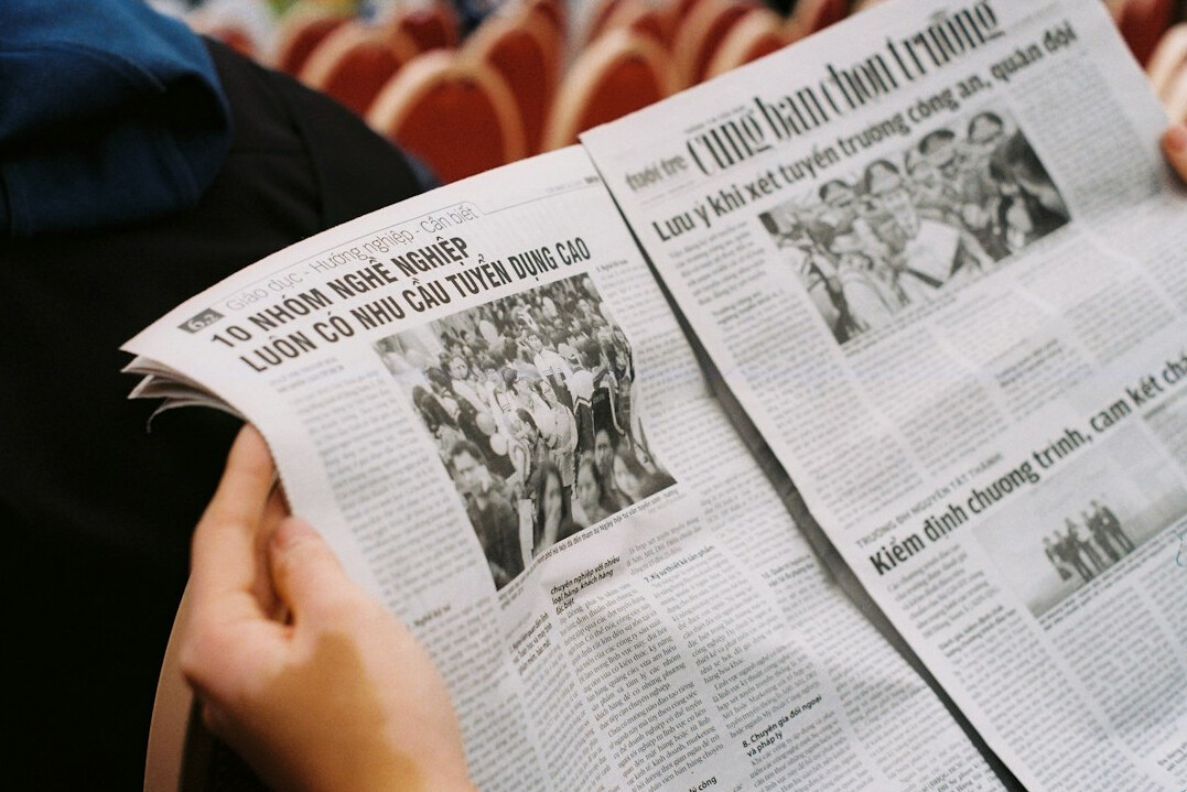 person reading newspaper